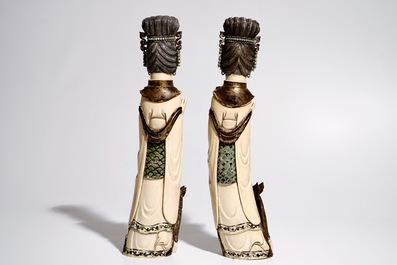 A pair of large polychrome ivory ladies with removable heads, 19/20th C.